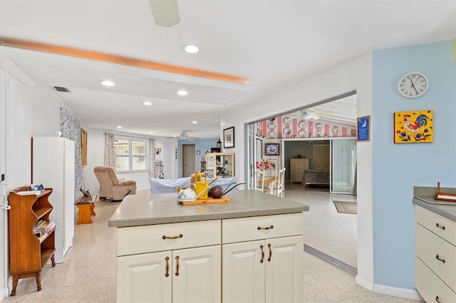 kitchen featuring ceiling fan