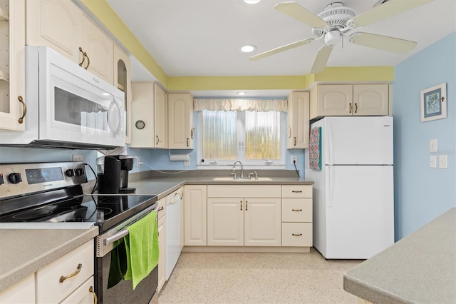 kitchen with sink, white appliances, and ceiling fan