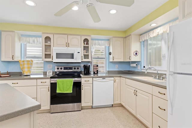 kitchen featuring sink, white appliances, and ceiling fan