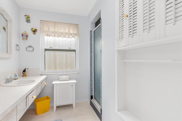 bathroom featuring an enclosed shower, vanity, and tile patterned floors