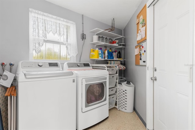 washroom with washer and dryer