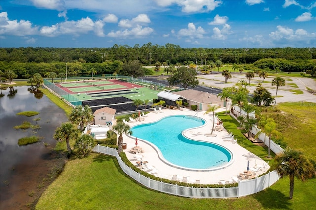 view of swimming pool with a yard and a patio area