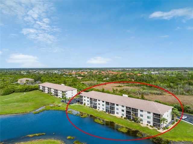 birds eye view of property featuring a water view