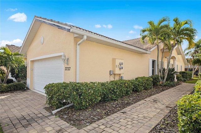 view of side of property featuring a garage