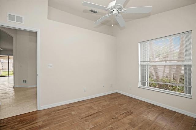 empty room featuring hardwood / wood-style floors and ceiling fan