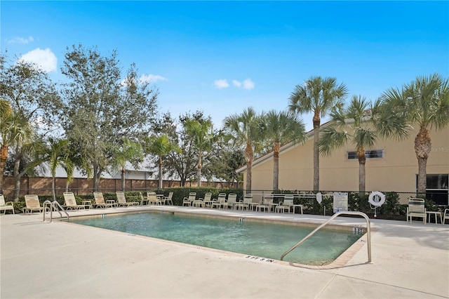 view of swimming pool with a patio