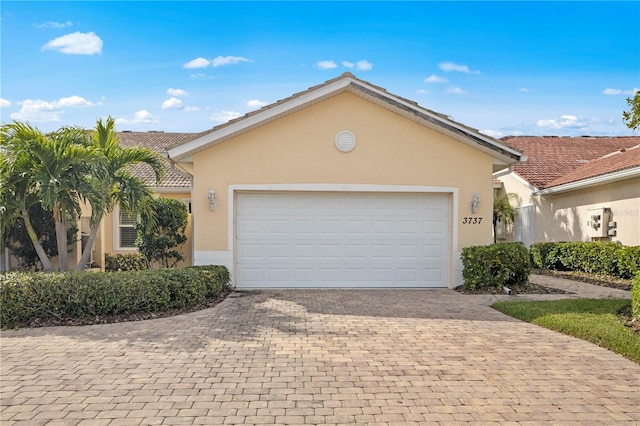 single story home featuring a garage