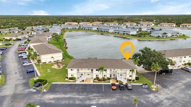 aerial view featuring a water view and a residential view