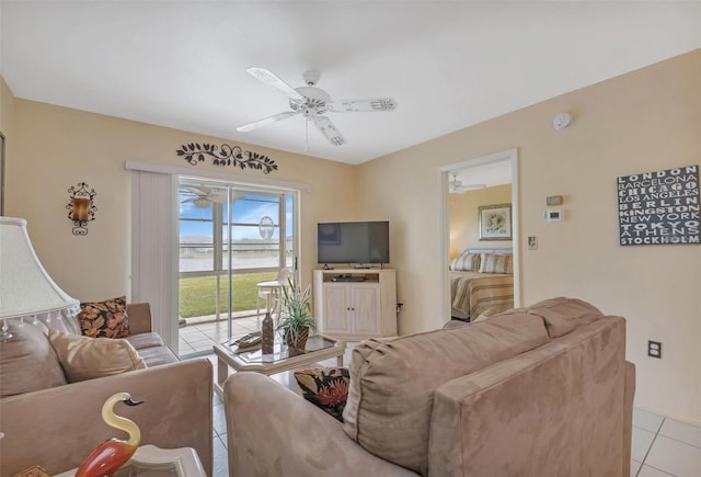 tiled living room featuring ceiling fan