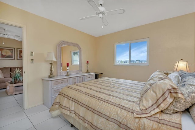 bedroom featuring light tile patterned flooring and ceiling fan