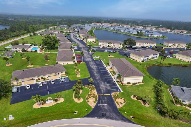 birds eye view of property with a water view