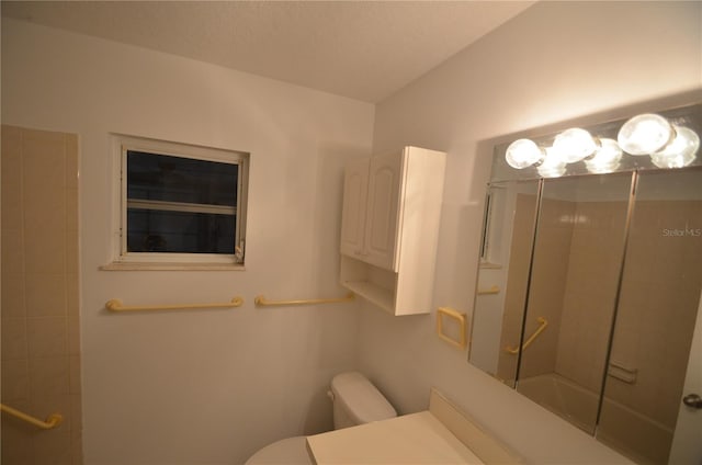 bathroom featuring shower / bathtub combination and toilet