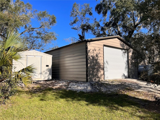 garage featuring a yard