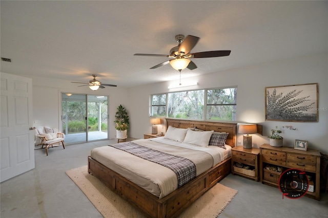 bedroom featuring ceiling fan, multiple windows, and access to outside