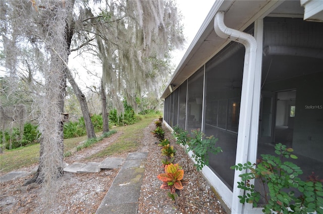 view of yard with a sunroom