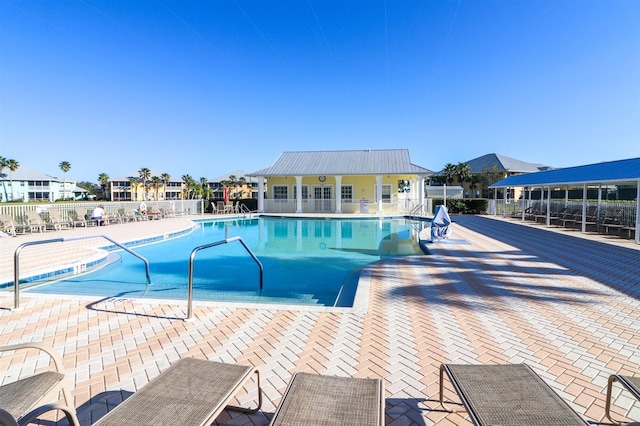 view of swimming pool featuring a patio area