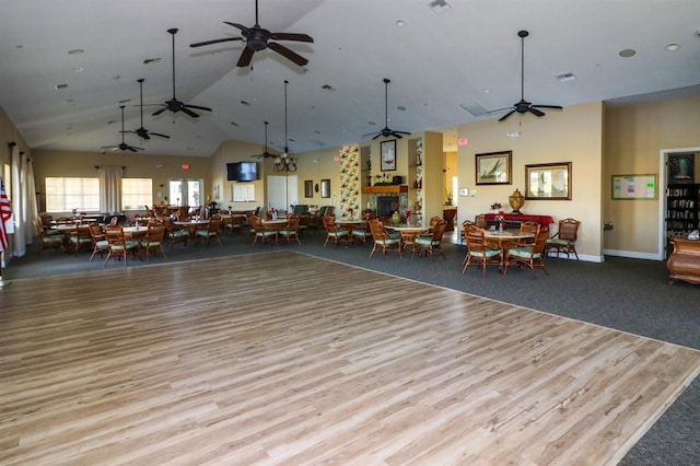 interior space featuring light wood-type flooring and vaulted ceiling