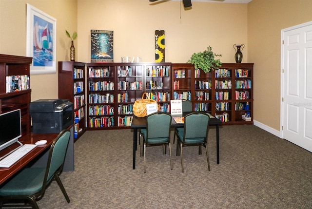 carpeted home office with ceiling fan