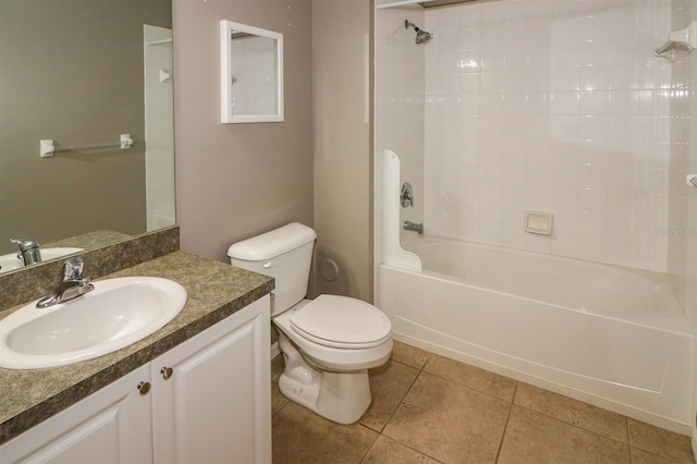 full bathroom with washtub / shower combination, vanity, tile patterned floors, and toilet