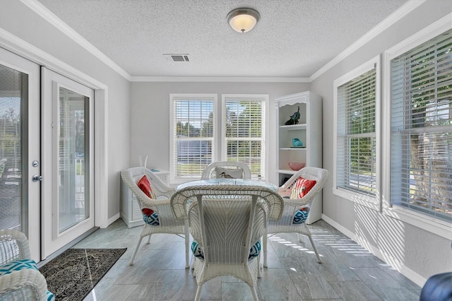 sunroom with french doors and a healthy amount of sunlight