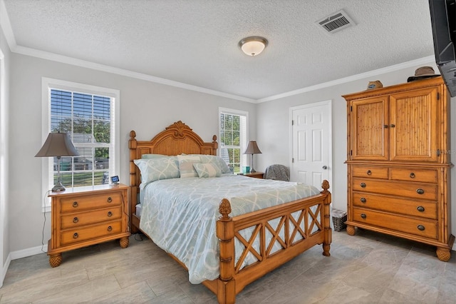 bedroom with a textured ceiling and crown molding