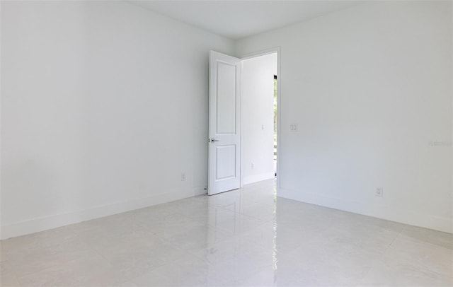 unfurnished room featuring light tile patterned floors