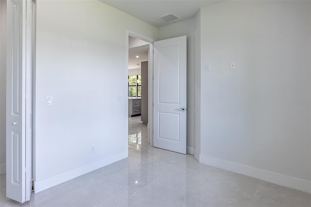 view of tiled spare room