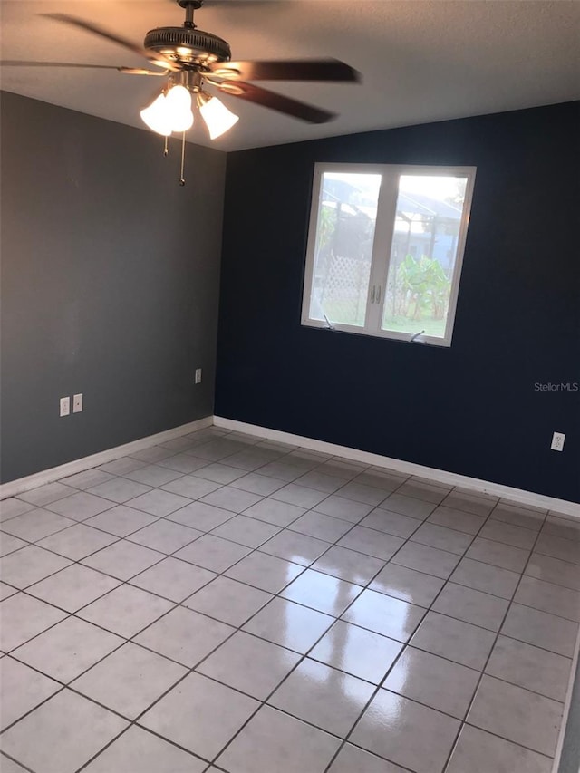4127 Gardner Dr, Port Charlotte, FL 33952 - spare room with light tile patterned floors, baseboards, and a ceiling fan