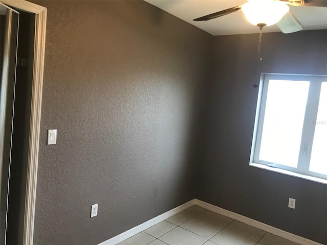 4127 Gardner Dr, Port Charlotte, FL 33952 - unfurnished room featuring light tile patterned floors, a ceiling fan, and baseboards