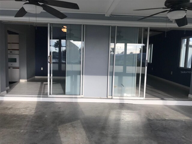 4127 Gardner Dr, Port Charlotte, FL 33952 - empty room featuring concrete flooring and a ceiling fan