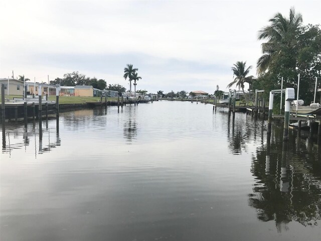 4127 Gardner Dr, Port Charlotte, FL 33952 - property view of water with a dock and boat lift