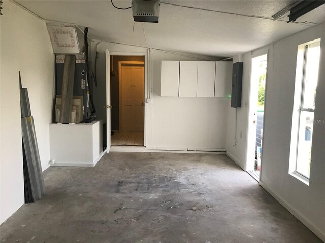 4127 Gardner Dr, Port Charlotte, FL 33952 - garage with heating unit, electric panel, and a garage door opener