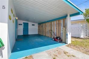 view of patio / terrace featuring a carport