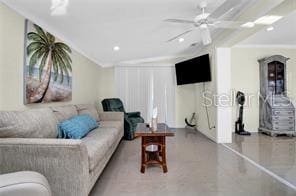 living room featuring ornamental molding and ceiling fan