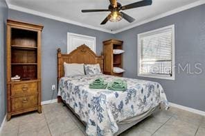 tiled bedroom with multiple windows and ornamental molding