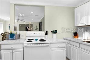 kitchen with white cabinetry, white electric range, and kitchen peninsula