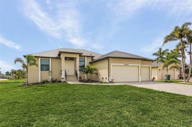 view of front facade with a front yard and a garage