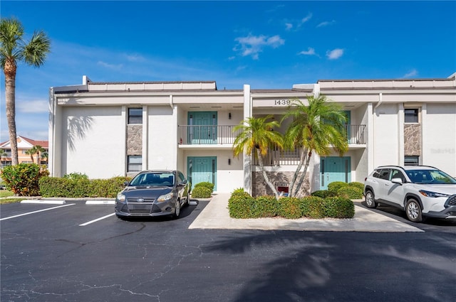 1439 Mediterranean Dr Unit C, Punta Gorda, FL 33950 - view of building exterior with uncovered parking