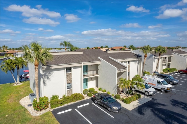 1439 Mediterranean Dr Unit C, Punta Gorda, FL 33950 - view of property featuring a residential view and uncovered parking