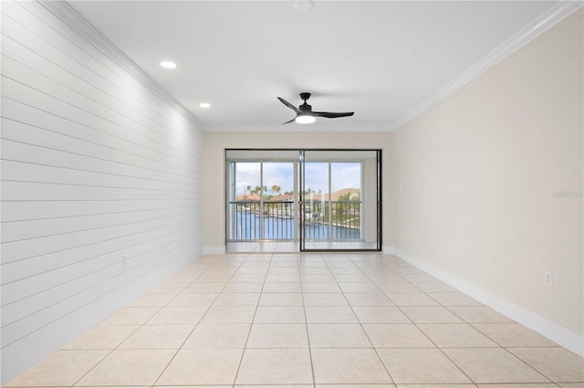 1439 Mediterranean Dr Unit C, Punta Gorda, FL 33950 - spare room featuring a ceiling fan, light tile patterned flooring, ornamental molding, and baseboards