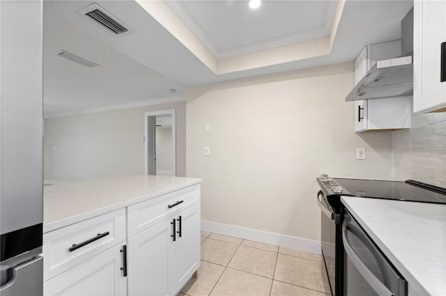 kitchen with white cabinets, electric stove, backsplash, light tile patterned floors, and ornamental molding