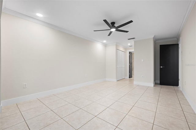 spare room with light tile patterned floors, ornamental molding, and ceiling fan