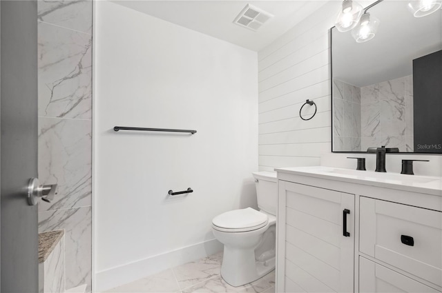 1439 Mediterranean Dr Unit C, Punta Gorda, FL 33950 - full bath with vanity, toilet, baseboards, marble finish floor, and visible vents
