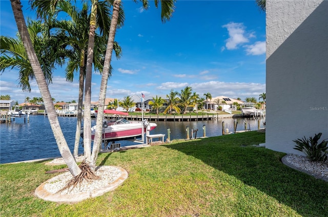 1439 Mediterranean Dr Unit C, Punta Gorda, FL 33950 - view of dock with boat lift, a water view, and a lawn