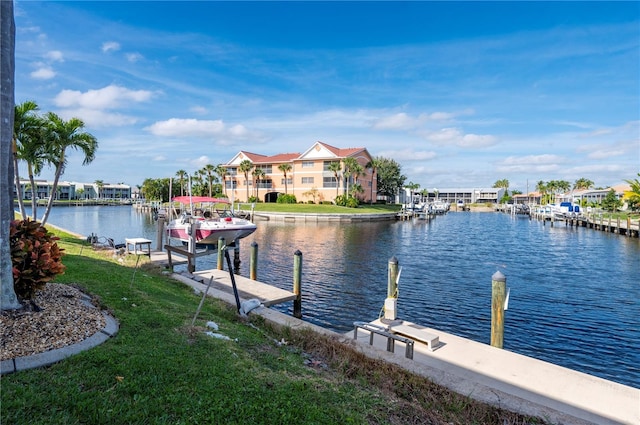 dock area featuring a yard and a water view