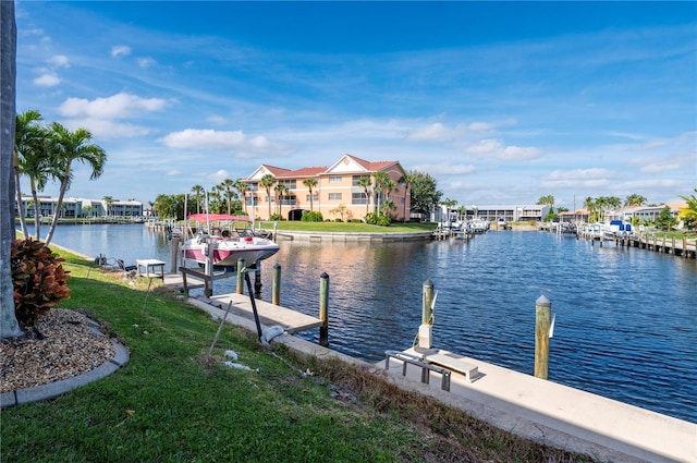 1439 Mediterranean Dr Unit C, Punta Gorda, FL 33950 - view of dock with a water view, a lawn, and boat lift