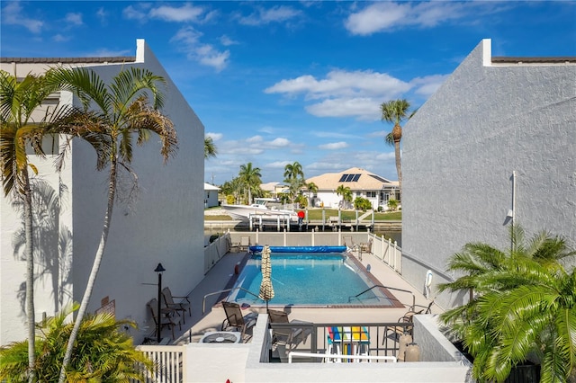 view of swimming pool featuring a patio area