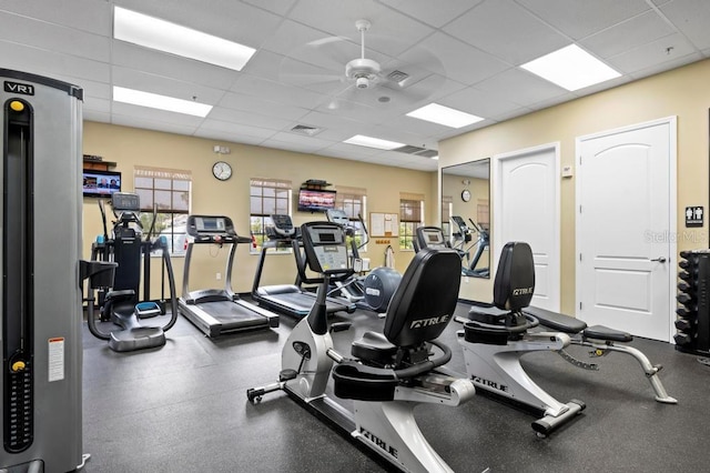 workout area with a drop ceiling and ceiling fan