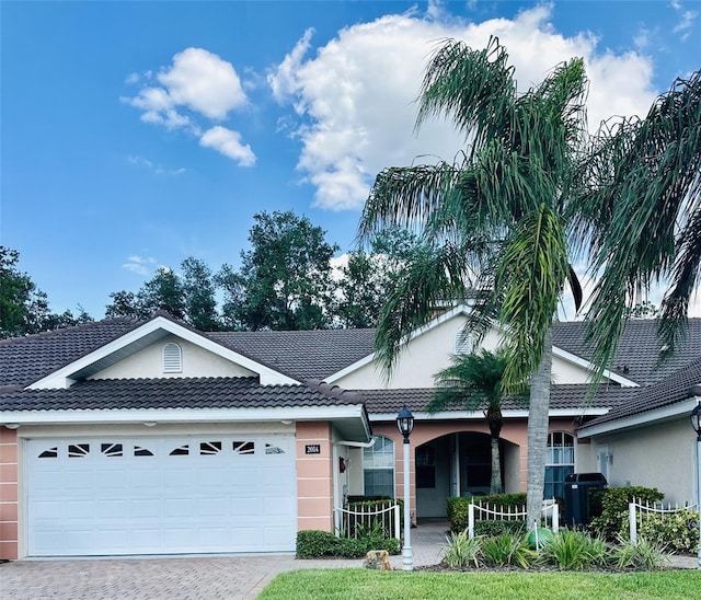 ranch-style home with a garage