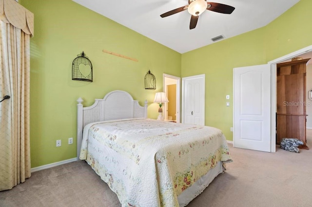 bedroom with light carpet and ceiling fan